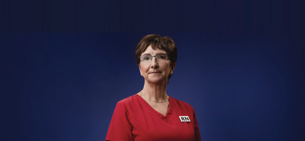 Registered Nurse in red scrubs