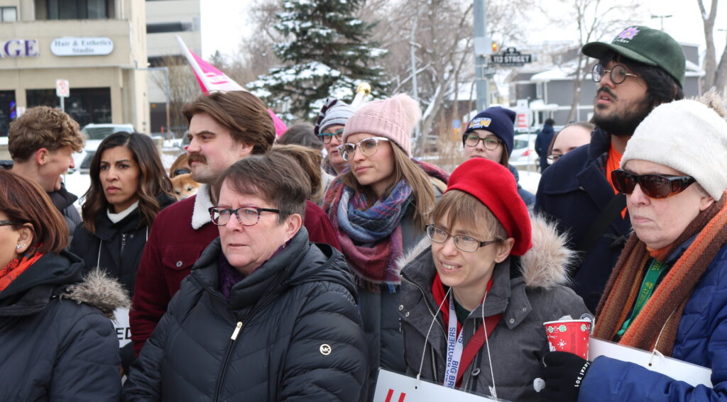crowd of nurses in winter clothes at a rally